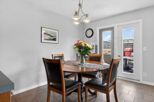 348 Midlake Boulevard Se, Calgary, AB - Indoor Photo Showing Dining Room