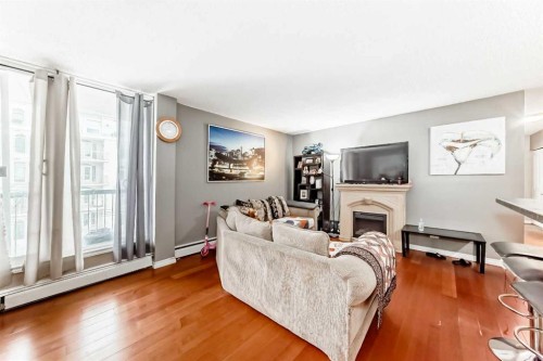501-1312 13 Avenue Sw, Calgary, AB - Indoor Photo Showing Living Room With Fireplace