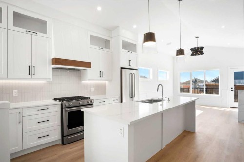 622 Mandalay Boulevard, Carstairs, AB - Indoor Photo Showing Kitchen With Stainless Steel Kitchen With Double Sink With Upgraded Kitchen