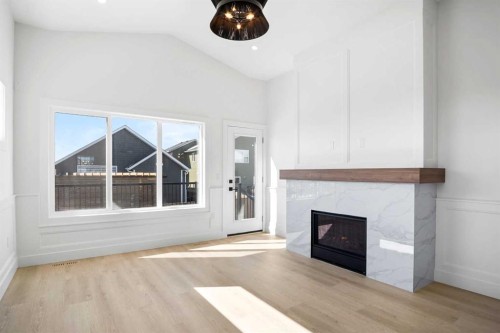 622 Mandalay Boulevard, Carstairs, AB - Indoor Photo Showing Living Room With Fireplace