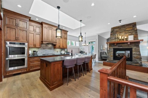 120 Elgin Estates View Se, Calgary, AB - Indoor Photo Showing Kitchen With Fireplace
