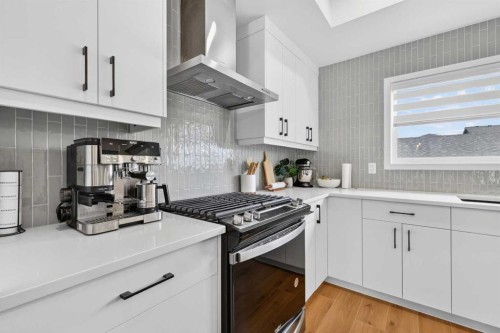 14 Wolf Creek Rise Se, Calgary, AB - Indoor Photo Showing Kitchen With Upgraded Kitchen