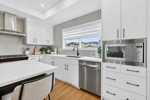 14 Wolf Creek Rise Se, Calgary, AB - Indoor Photo Showing Kitchen With Upgraded Kitchen