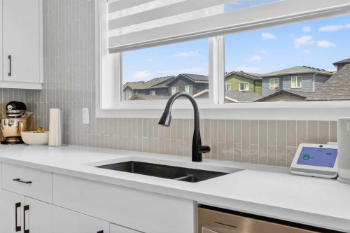 14 Wolf Creek Rise Se, Calgary, AB - Indoor Photo Showing Kitchen With Double Sink