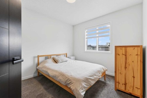 14 Wolf Creek Rise Se, Calgary, AB - Indoor Photo Showing Bedroom