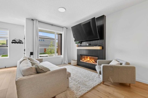 14 Wolf Creek Rise Se, Calgary, AB - Indoor Photo Showing Living Room With Fireplace