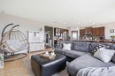 99 Sunset View, Cochrane, AB  - Indoor Photo Showing Living Room 