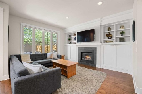 729 4 Street Nw, Calgary, AB - Indoor Photo Showing Living Room With Fireplace