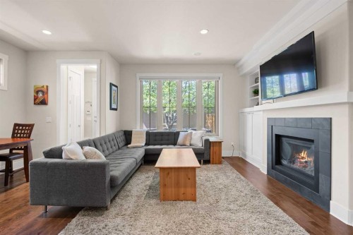 729 4 Street Nw, Calgary, AB - Indoor Photo Showing Living Room With Fireplace