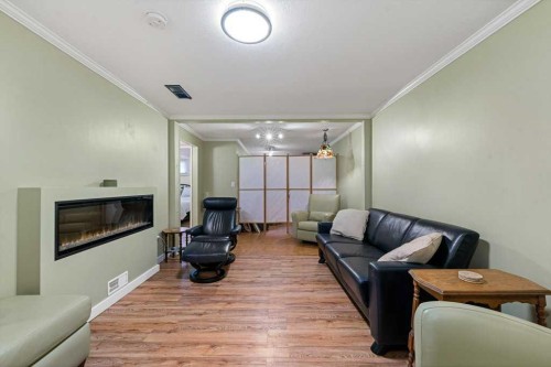 1632 Robson Crescent Se, Calgary, AB - Indoor Photo Showing Living Room With Fireplace