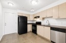 1128-2395 Eversyde Avenue Sw, Calgary, AB  - Indoor Photo Showing Kitchen 
