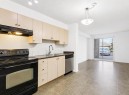 1128-2395 Eversyde Avenue Sw, Calgary, AB  - Indoor Photo Showing Kitchen 