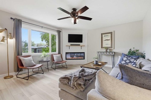 8343 48 Avenue Nw, Calgary, AB - Indoor Photo Showing Living Room With Fireplace