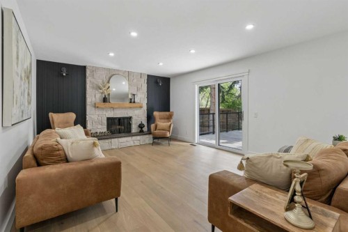 111 Canata Close Sw, Calgary, AB - Indoor Photo Showing Living Room With Fireplace