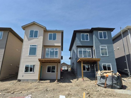 450 River Avenue, Cochrane, AB - Outdoor With Facade
