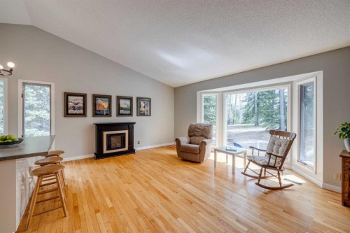 41 Elk Valley Crescent, Bragg Creek, AB - Indoor Photo Showing Living Room With Fireplace