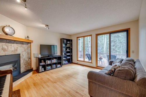41 Elk Valley Crescent, Bragg Creek, AB - Indoor Photo Showing Living Room With Fireplace