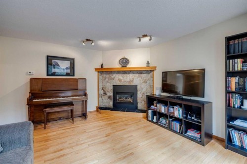 41 Elk Valley Crescent, Bragg Creek, AB - Indoor Photo Showing Living Room With Fireplace