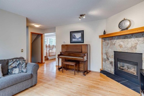 41 Elk Valley Crescent, Bragg Creek, AB - Indoor Photo Showing Living Room With Fireplace