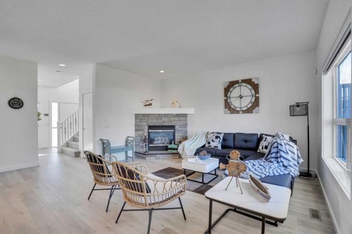 92 Prestwick Heath Se, Calgary, AB - Indoor Photo Showing Living Room With Fireplace