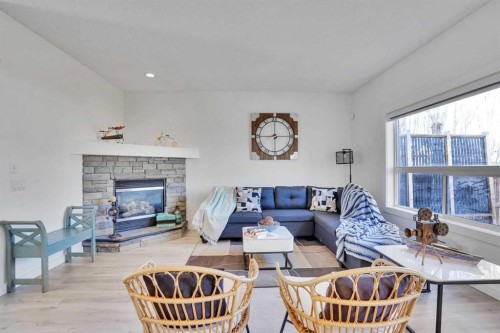 92 Prestwick Heath Se, Calgary, AB - Indoor Photo Showing Living Room With Fireplace