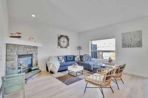 92 Prestwick Heath Se, Calgary, AB - Indoor Photo Showing Living Room With Fireplace