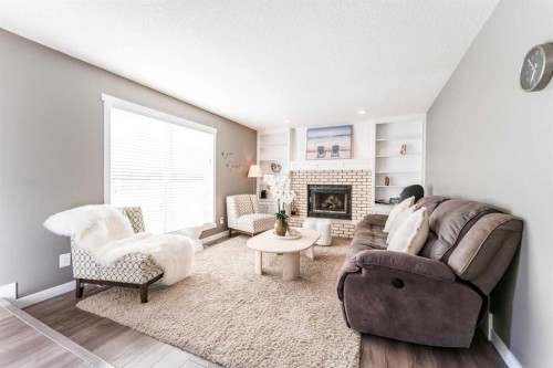 145 Hawkdale Circle Nw, Calgary, AB - Indoor Photo Showing Living Room With Fireplace
