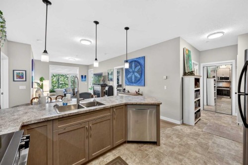 216-35 Aspenmont Heights Sw, Calgary, AB - Indoor Photo Showing Kitchen With Double Sink