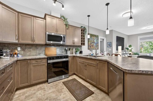 216-35 Aspenmont Heights Sw, Calgary, AB - Indoor Photo Showing Kitchen With Double Sink With Upgraded Kitchen