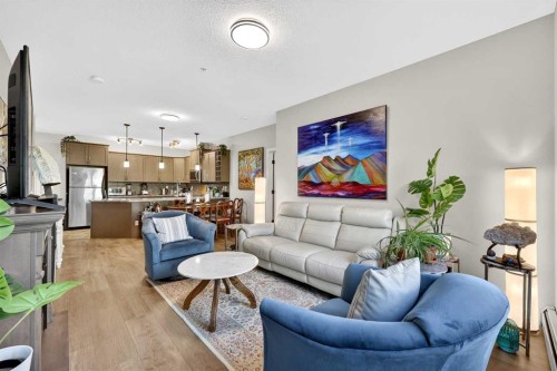 216-35 Aspenmont Heights Sw, Calgary, AB - Indoor Photo Showing Living Room