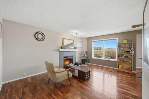 86 Saddlecrest Close Ne, Calgary, AB - Indoor Photo Showing Living Room With Fireplace
