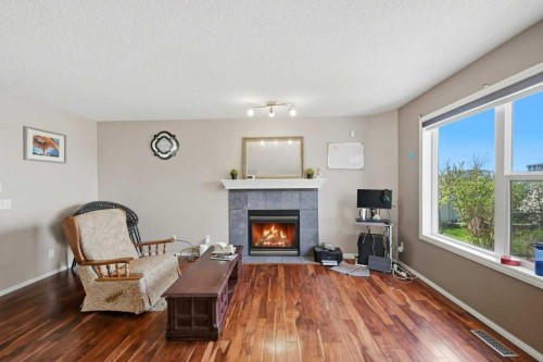 86 Saddlecrest Close Ne, Calgary, AB - Indoor Photo Showing Living Room With Fireplace