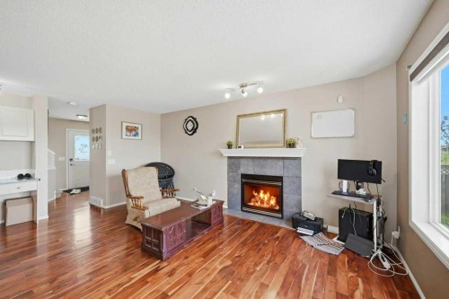 86 Saddlecrest Close Ne, Calgary, AB - Indoor Photo Showing Living Room With Fireplace