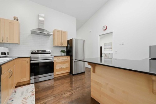 84 Coach Gate Way Sw, Calgary, AB - Indoor Photo Showing Kitchen With Stainless Steel Kitchen