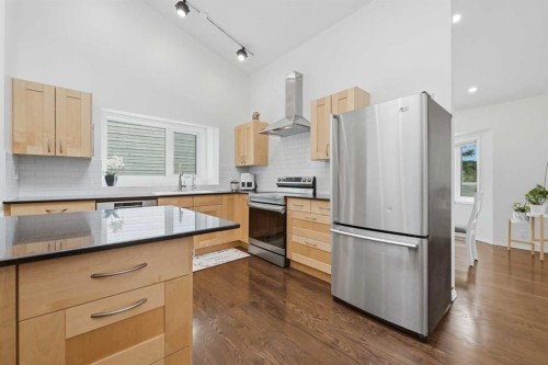 84 Coach Gate Way Sw, Calgary, AB - Indoor Photo Showing Kitchen With Stainless Steel Kitchen