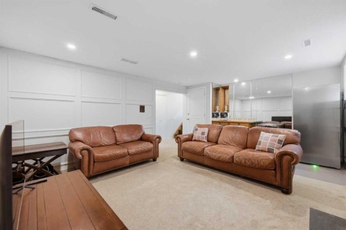 84 Coach Gate Way Sw, Calgary, AB - Indoor Photo Showing Living Room