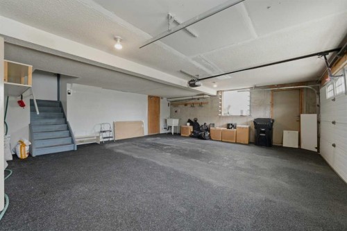84 Coach Gate Way Sw, Calgary, AB - Indoor Photo Showing Garage