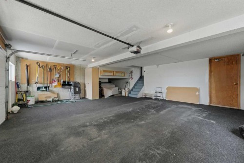 84 Coach Gate Way Sw, Calgary, AB - Indoor Photo Showing Garage