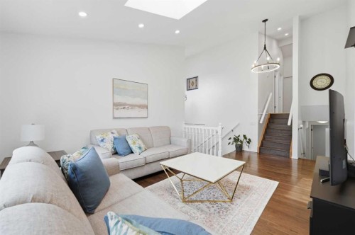 84 Coach Gate Way Sw, Calgary, AB - Indoor Photo Showing Living Room