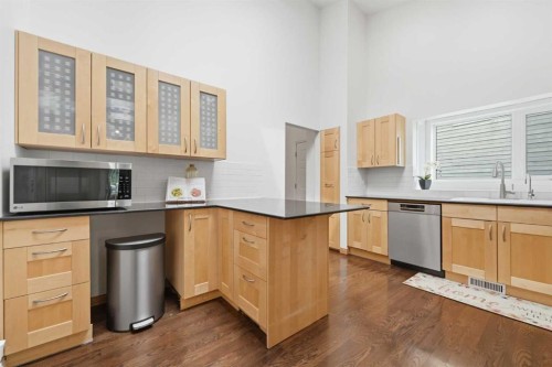 84 Coach Gate Way Sw, Calgary, AB - Indoor Photo Showing Kitchen With Stainless Steel Kitchen