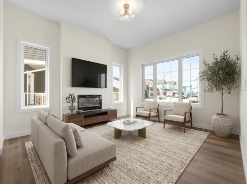 568 Buffaloberry Manor Se, Calgary, AB - Indoor Photo Showing Living Room With Fireplace