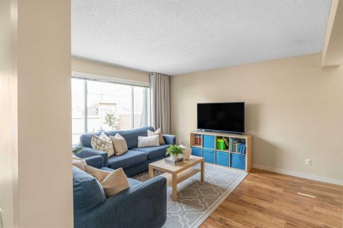 24 Copperpond Road Se, Calgary, AB - Indoor Photo Showing Living Room