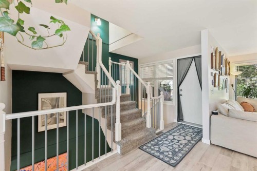 109 Coachway Lane Sw, Calgary, AB - Indoor Photo Showing Living Room With Fireplace
