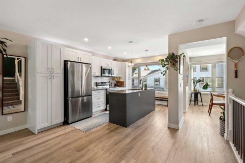 109 Coachway Lane Sw, Calgary, AB - Indoor Photo Showing Kitchen With Double Sink