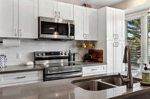 109 Coachway Lane Sw, Calgary, AB - Indoor Photo Showing Kitchen With Double Sink