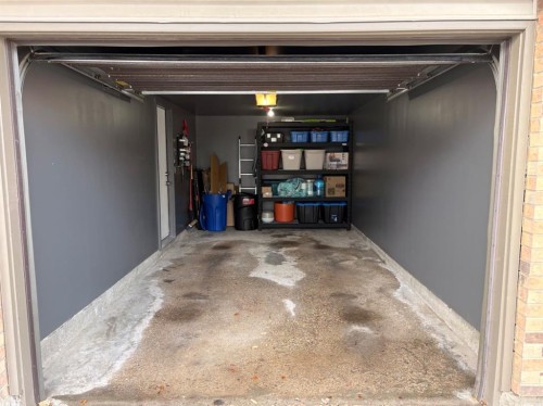 109 Coachway Lane Sw, Calgary, AB - Indoor Photo Showing Garage