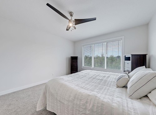548 Cranbrook Gardens Se, Calgary, AB - Indoor Photo Showing Bedroom