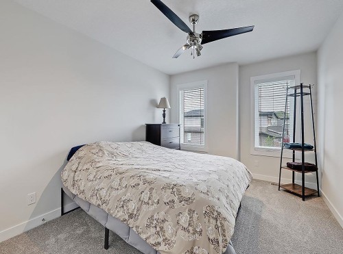 548 Cranbrook Gardens Se, Calgary, AB - Indoor Photo Showing Bedroom