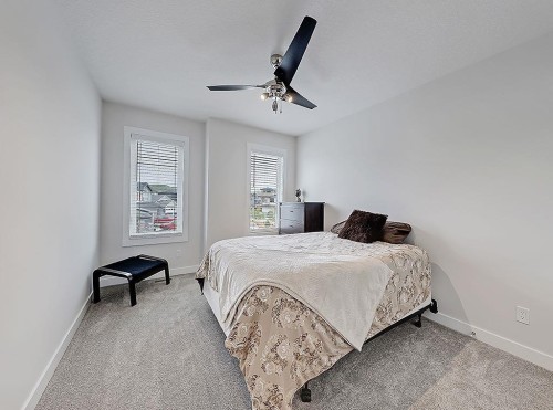 548 Cranbrook Gardens Se, Calgary, AB - Indoor Photo Showing Bedroom