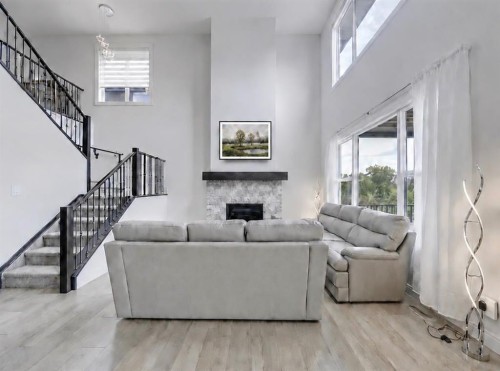 548 Cranbrook Gardens Se, Calgary, AB - Indoor Photo Showing Living Room With Fireplace